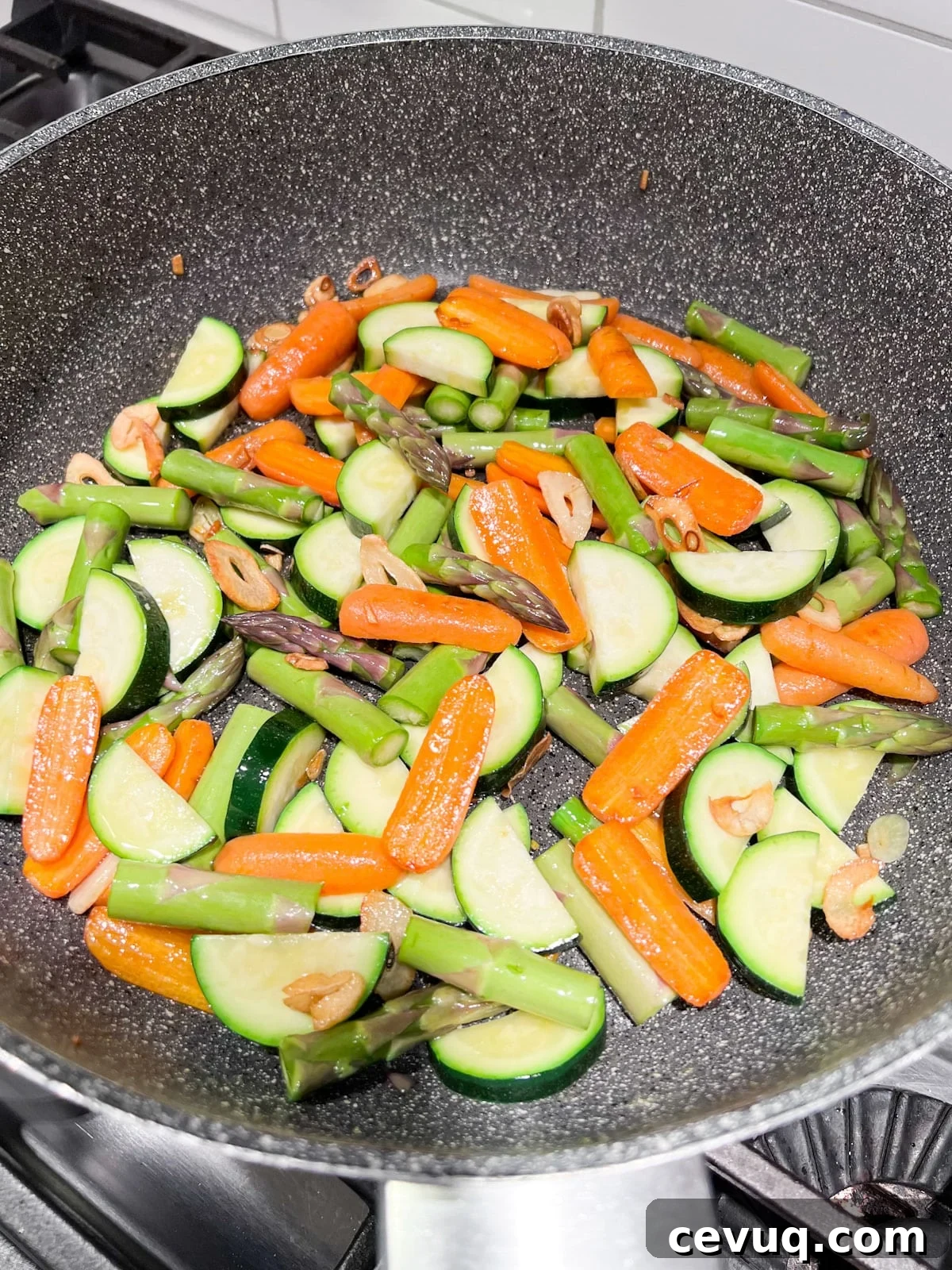 Asparagus and sliced zucchini added to the sauté pan.