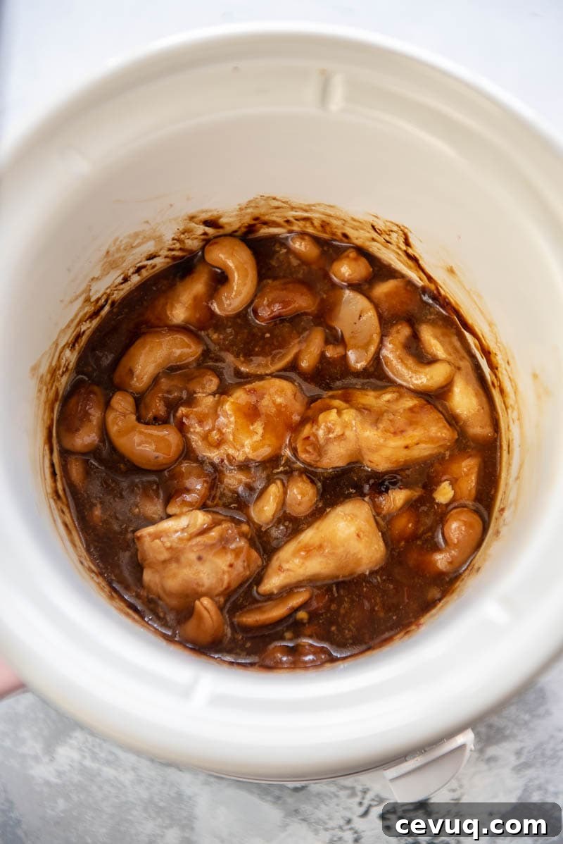 cooked cashew chicken in a slow cooker