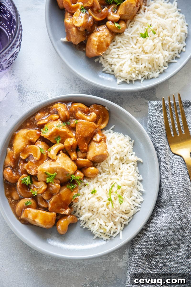 cashew chicken for two on plates with forks