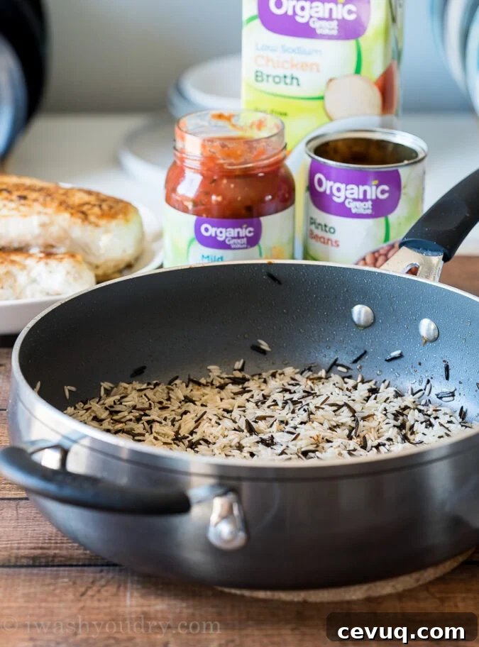 Toast the long grain and wild rice in Great Value Organic Olive Oil and a little butter before adding in chicken broth, salsa and lime juice!