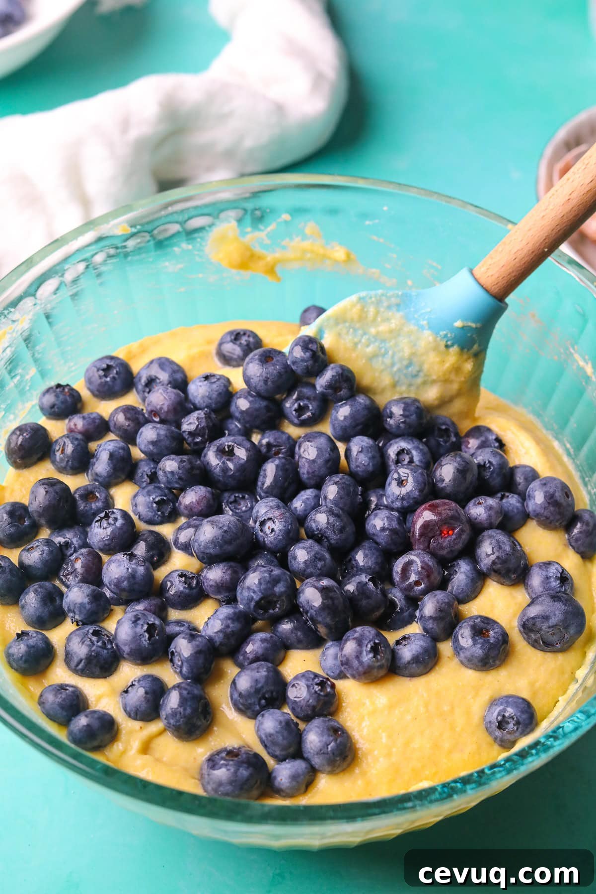 blueberry cornbread batter in a mixing bowl.