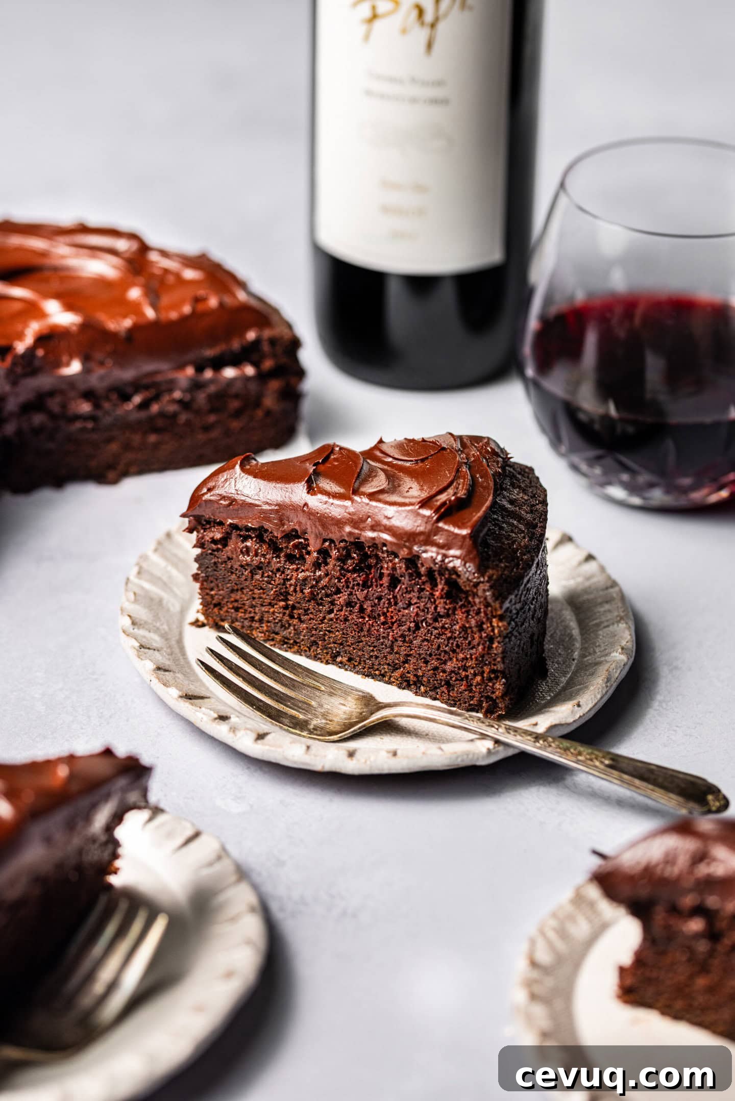 Close up of a slice of red wine chocolate cake showing off moist texture.