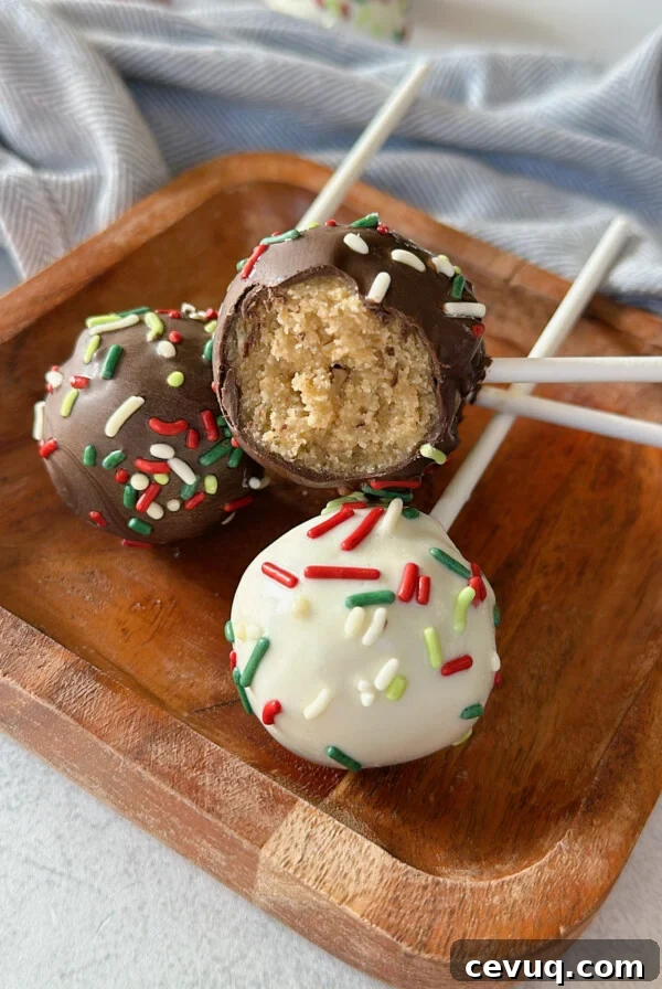 Christmas cake bites on a wooden plate.