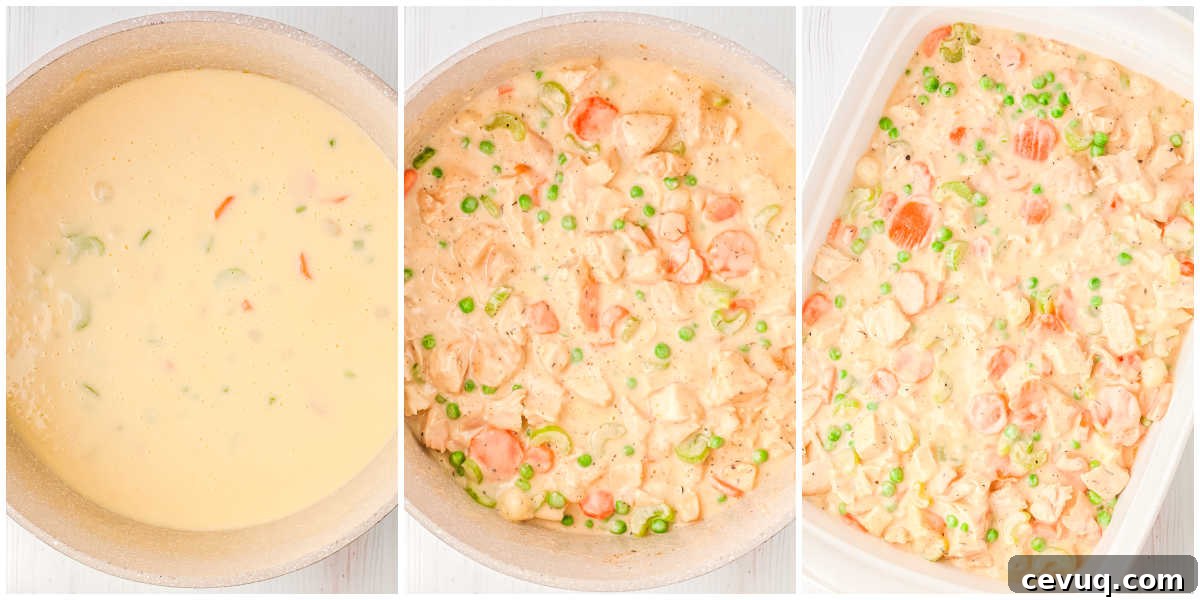 Creamy chicken pot pie filling in skillet with peas, carrots, celery, and cooked chicken before transferring to baking dish.