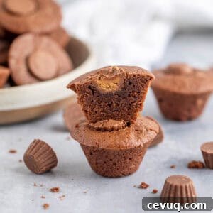 Brownie peanut butter cups stacked on a counter.