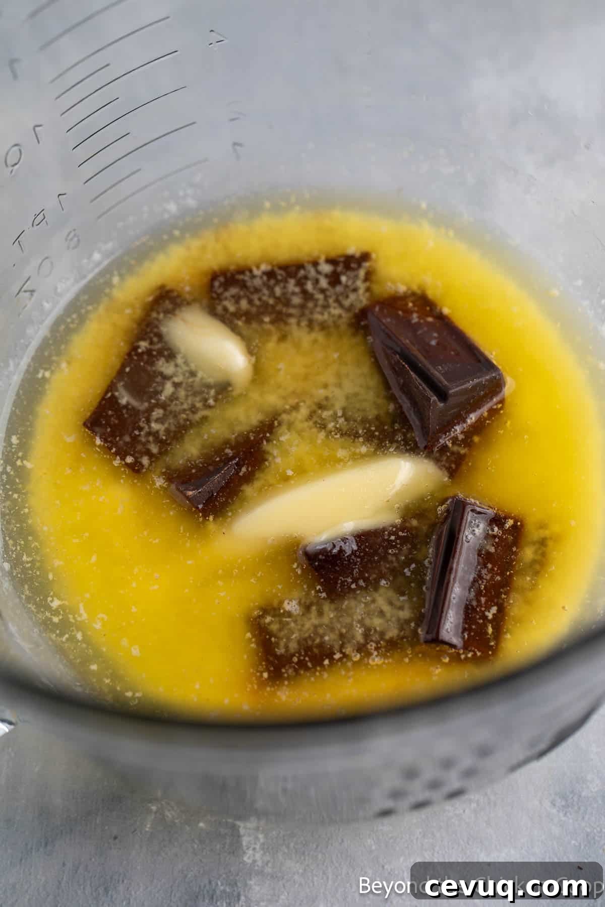 Butter and chocolate melting together in a bowl.