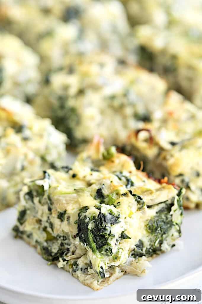 Close-up photo of one Spinach Artichoke Square.