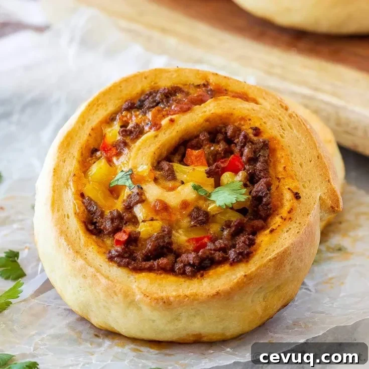 These taco pizza rolls are easy to make and taste amazing! Homemade pizza dough wrapped around taco meat, cheese and veggies - perfect for lunch or dinner!