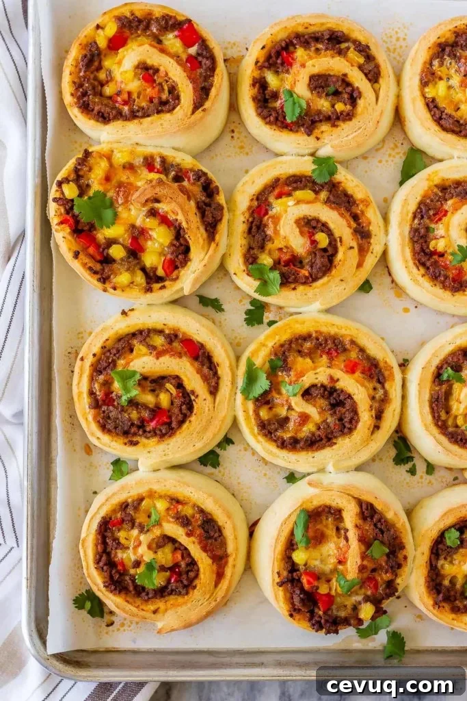 These taco pizza rolls are easy to make and taste amazing! Homemade pizza dough wrapped around taco meat, cheese and veggies - perfect for lunch or dinner!