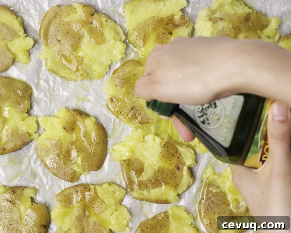 Seasoned smashed potatoes before baking