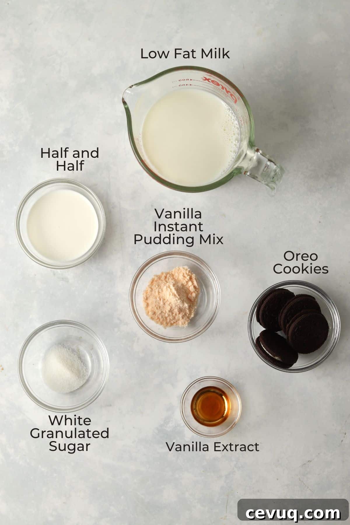 Milk, half and half, pudding mix, sugar, Oreos, and vanilla in glass prep bowls.