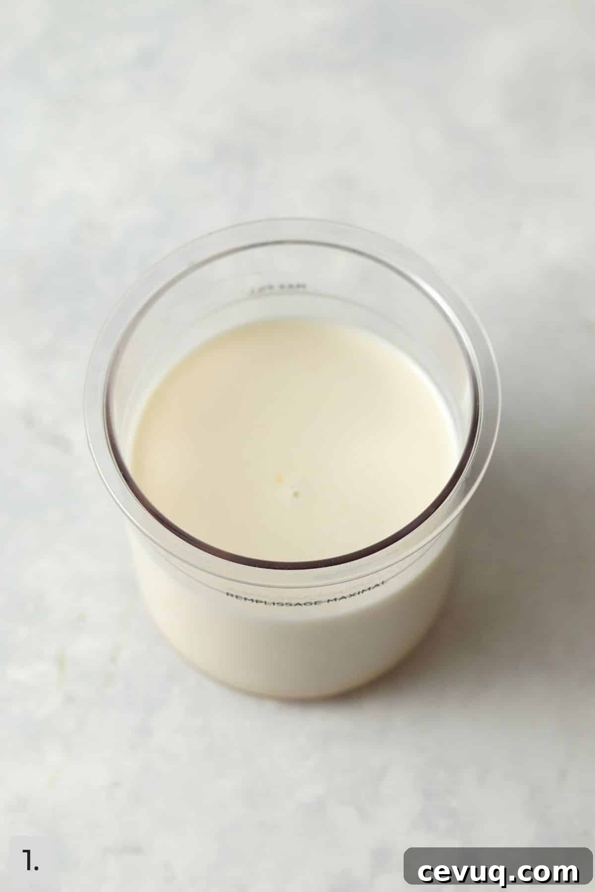Milk mixture in Ninja Creami pint.