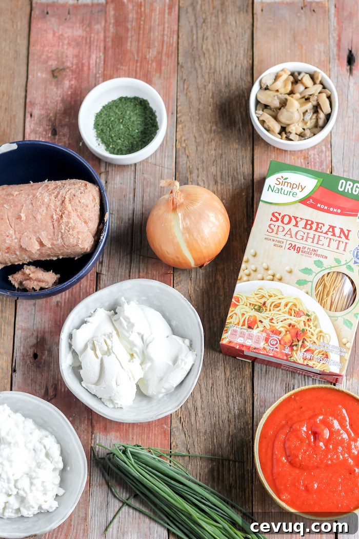 Images shows a table full of ingredients for baked spaghetti