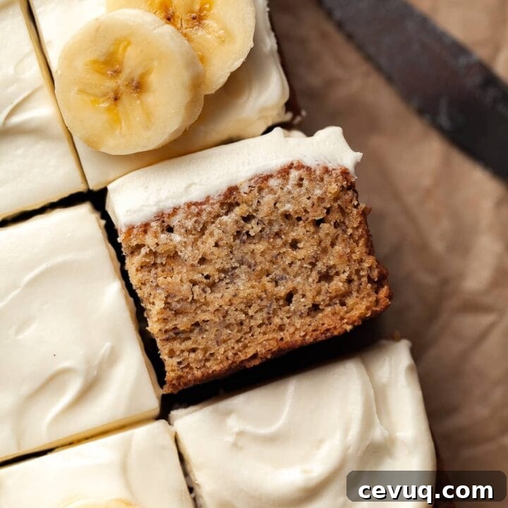sliced gluten free banana bars topped with cream cheese frosting and sliced bananas