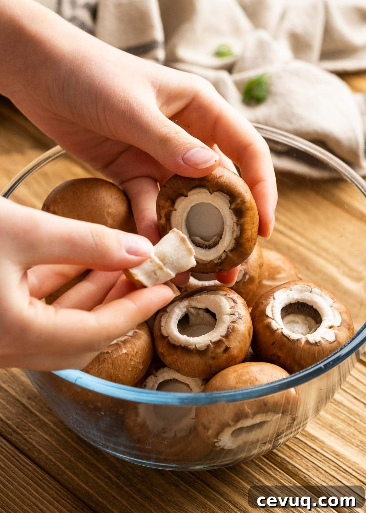 removing mushroom caps from small portabello mushrooms
