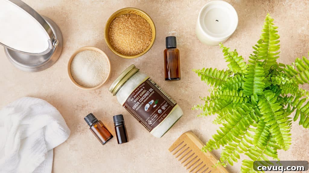 Dr. Bronner's coconut oil, bowls of sugar, and essential oils on a brown countertop. GIY Coconut Sugar Scrub