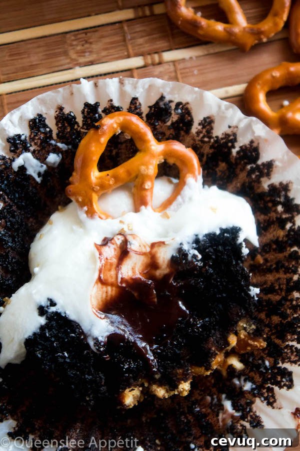 Beer-Infused Pretzel Cupcakes 6 These Beer and Pretzel Cupcakes are made with a salty crunchy pretzel crust, a beer flavoured chocolate cupcake filled with a beer ganache and topped with beer buttercream!