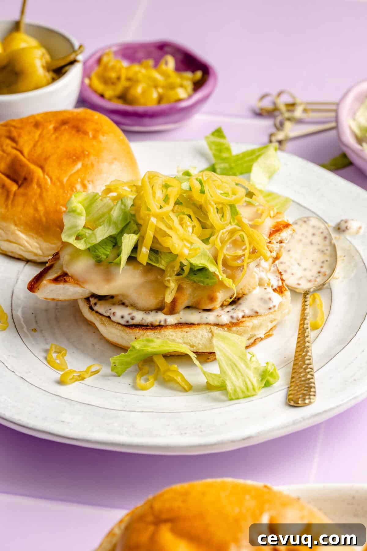 Pepperoncini Grilled Chicken Sandwich assembled on plate.