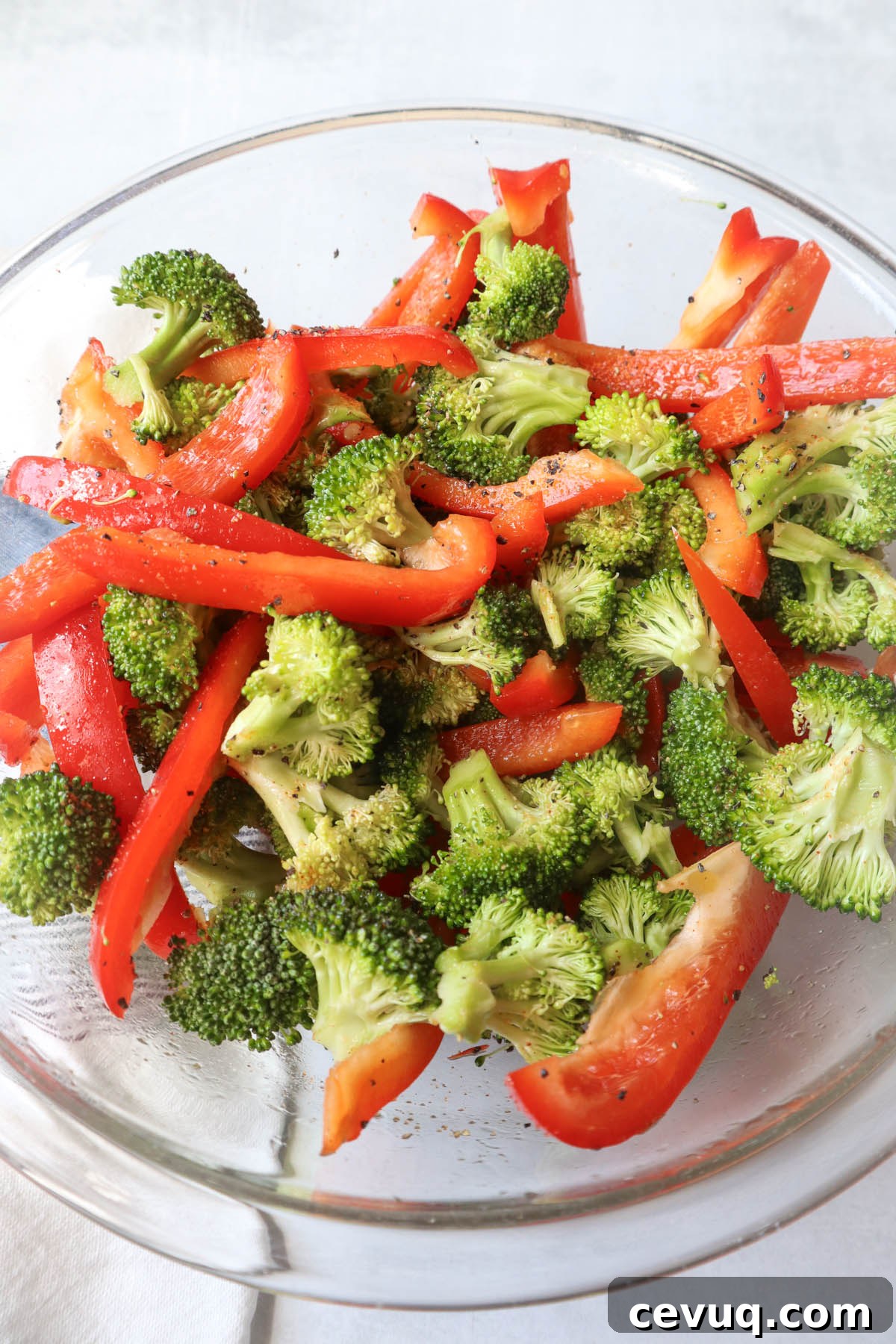 glass bowl with seasoned red pepper and broccoli