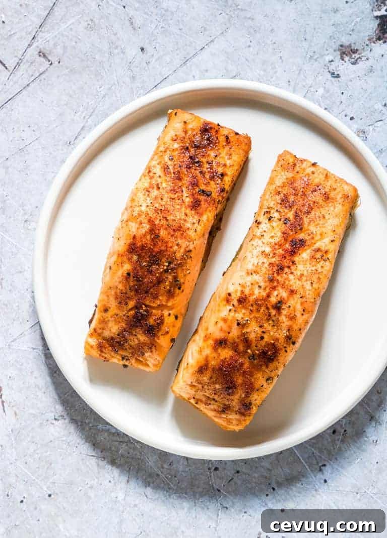 Two cooked Air Fryer Salmon fillets on a plate