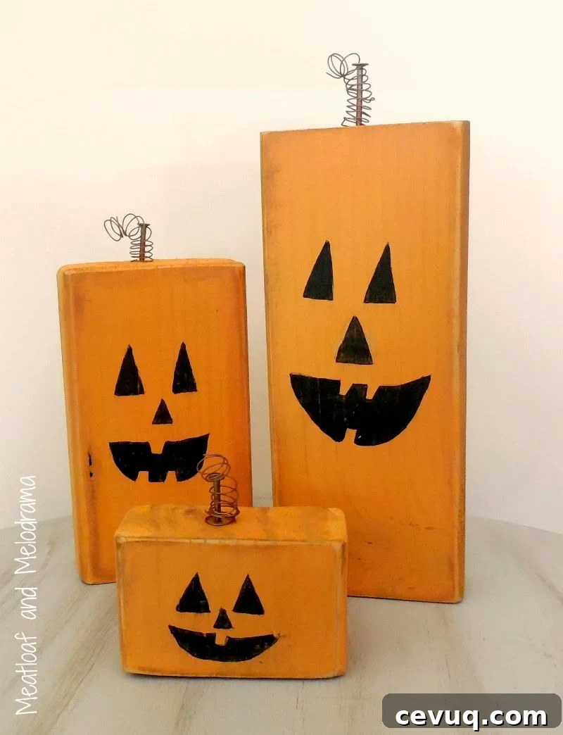 three wood pumpkins made from wood blocks