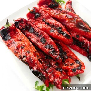 A large platter filled with grilled sweet peppers.