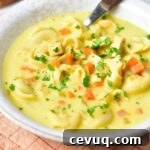 A bowl of chicken tortellini soup