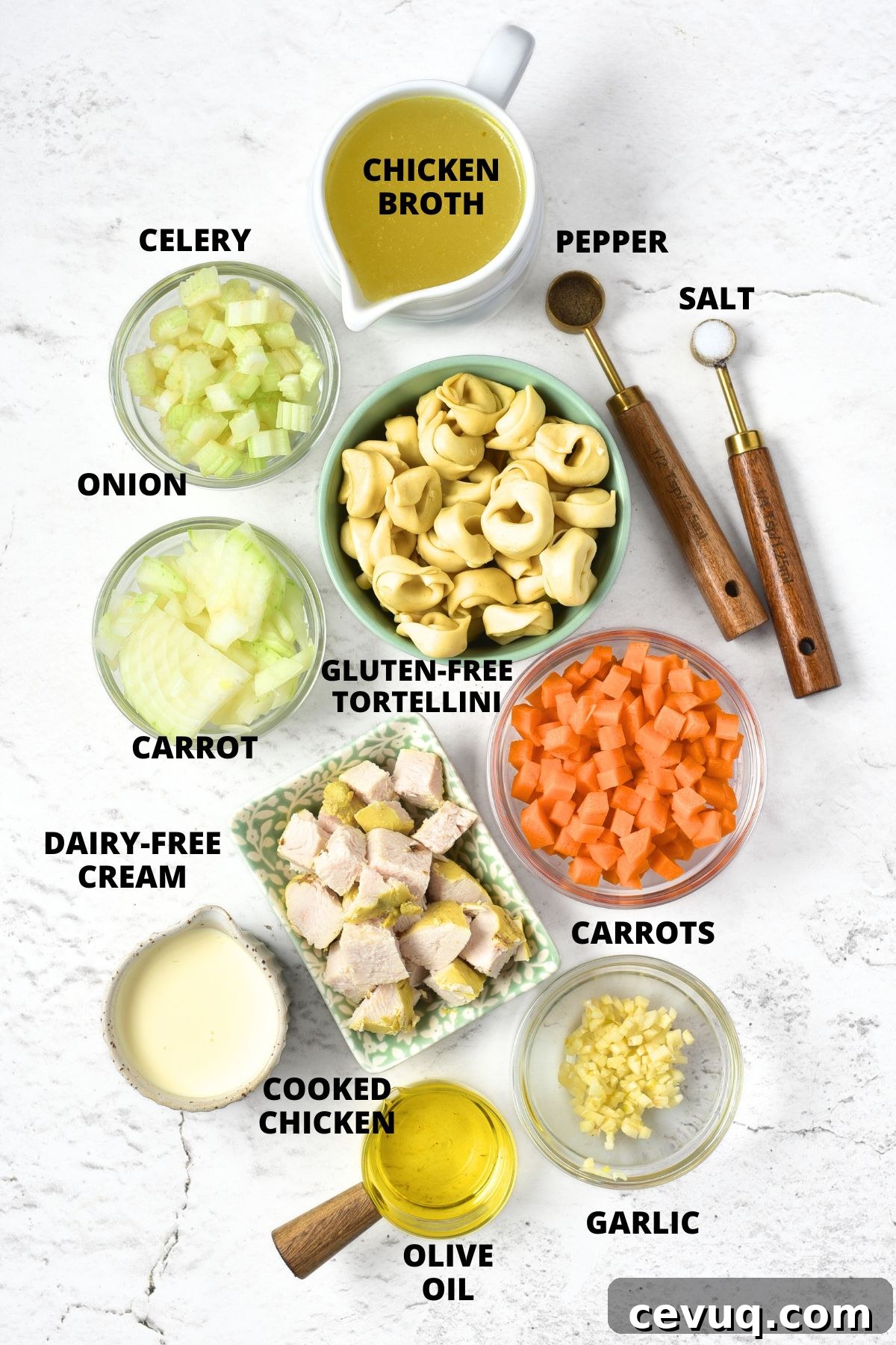 Ingredients for chicken tortellini soup recipe laid out on marble board