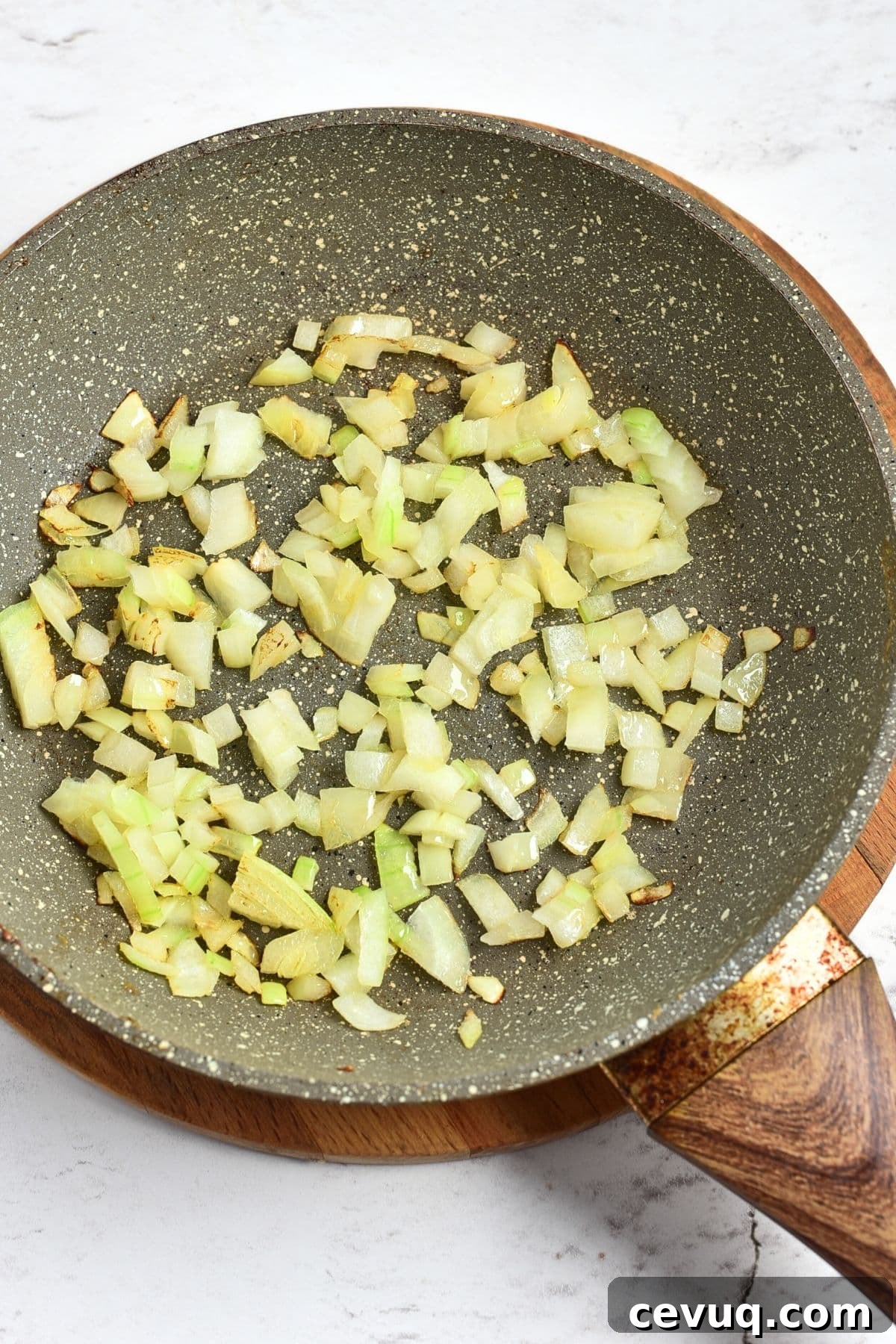 Sautéing diced onions in nonstick skillet