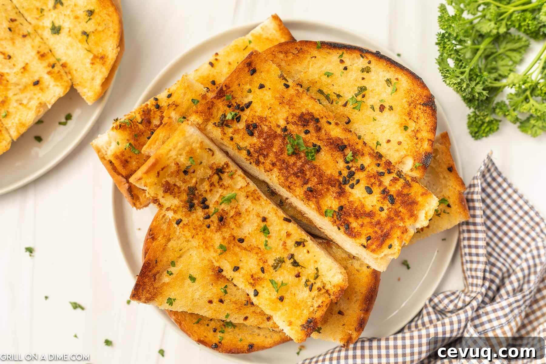 Blackstone Grill Garlic Bread Recipe: Crispy Grilled Loaf 2 Garlic bread sliced and stacked on a plate