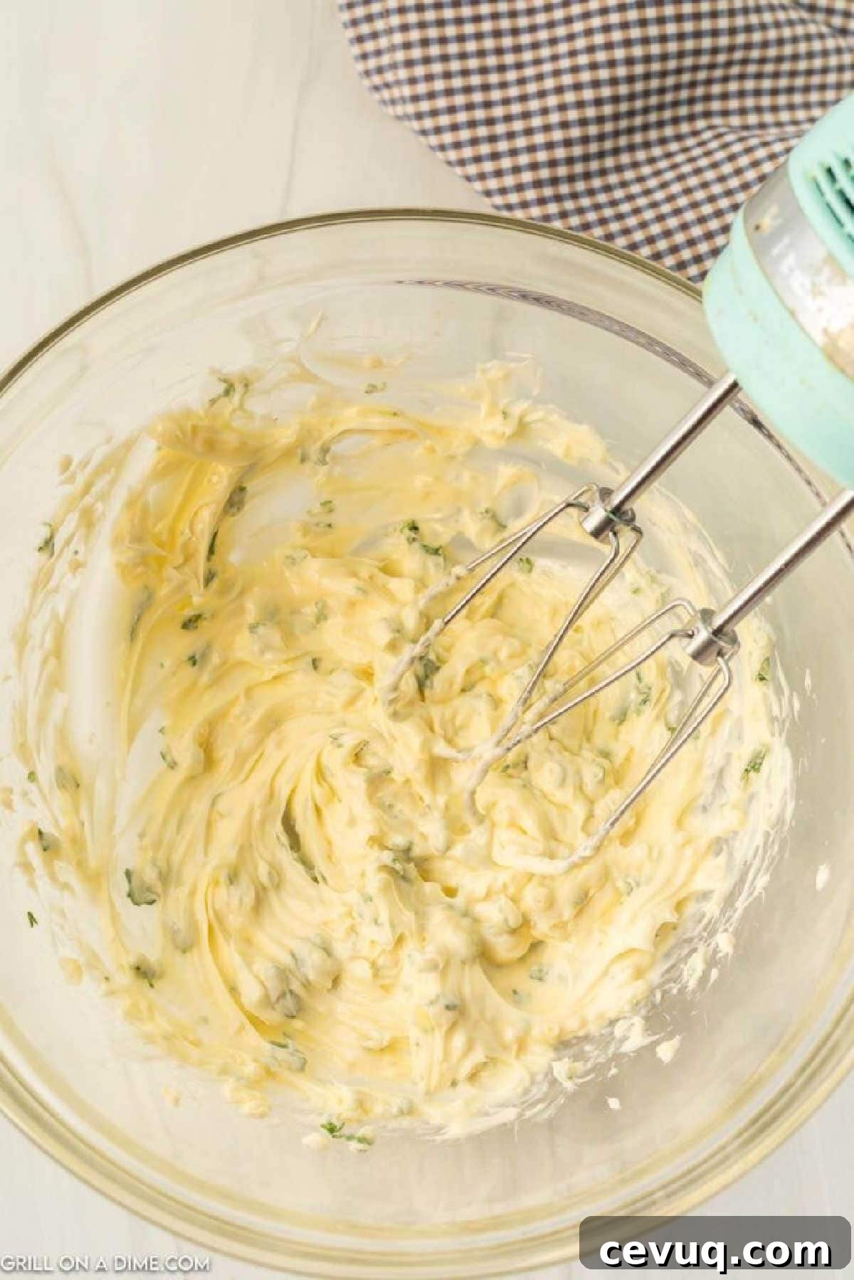 Blackstone Grill Garlic Bread Recipe: Crispy Grilled Loaf 4 Combining the ingredients in a bowl with a hand mixer
