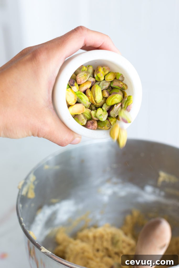 Tahini Pistachio White Chocolate Skillet Cookie with Rose 12 adding pistachios to skillet cookie dough