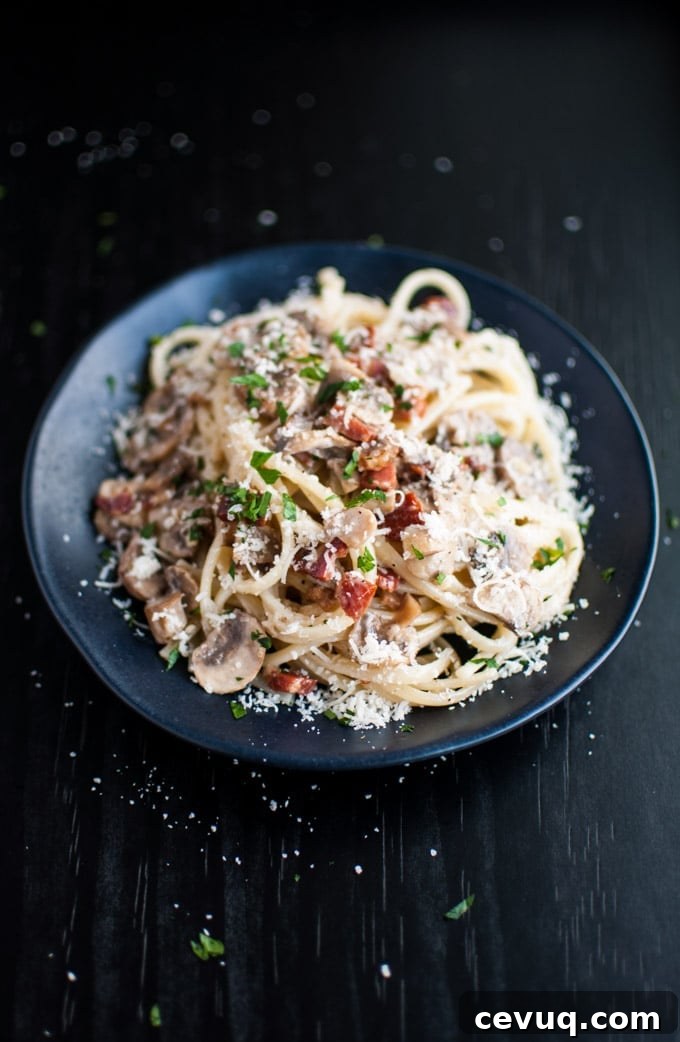 Pancetta, Mushroom & Garlic Pasta Recipe 2 black plate with pancetta, mushroom, and garlic pasta