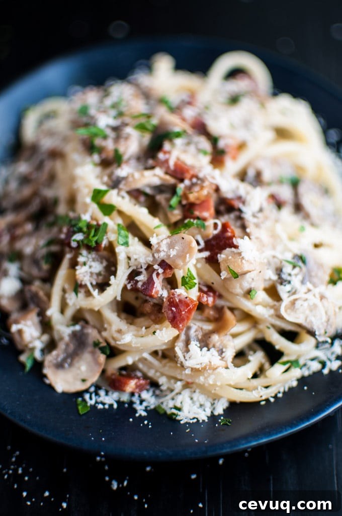 Pancetta, Mushroom & Garlic Pasta Recipe 3 close-up of pasta with pancetta, mushrooms, garlic, and grated parmesan