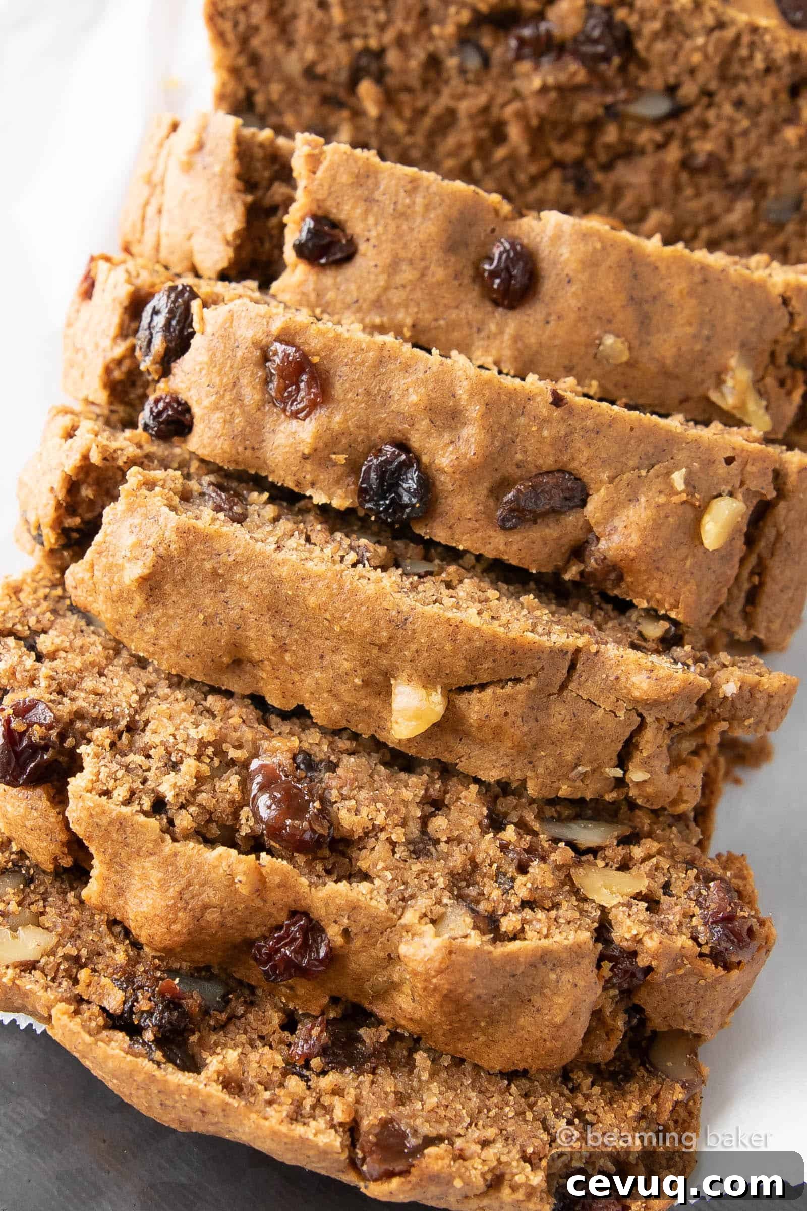 Vegan Cinnamon Raisin Quick Bread: rich, moist vegan quick bread bursting with juicy raisins under warm cinnamon. Gluten free.