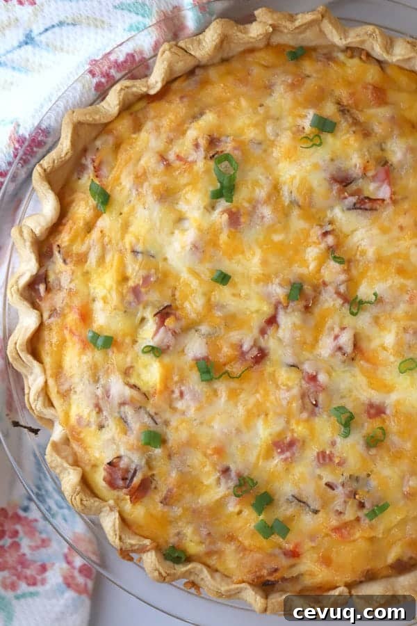 Classic Ham and Cheese Quiche with Flaky Crust 2 A pie plate with this ham and cheese quiche recipe in a flaky pie crust.
