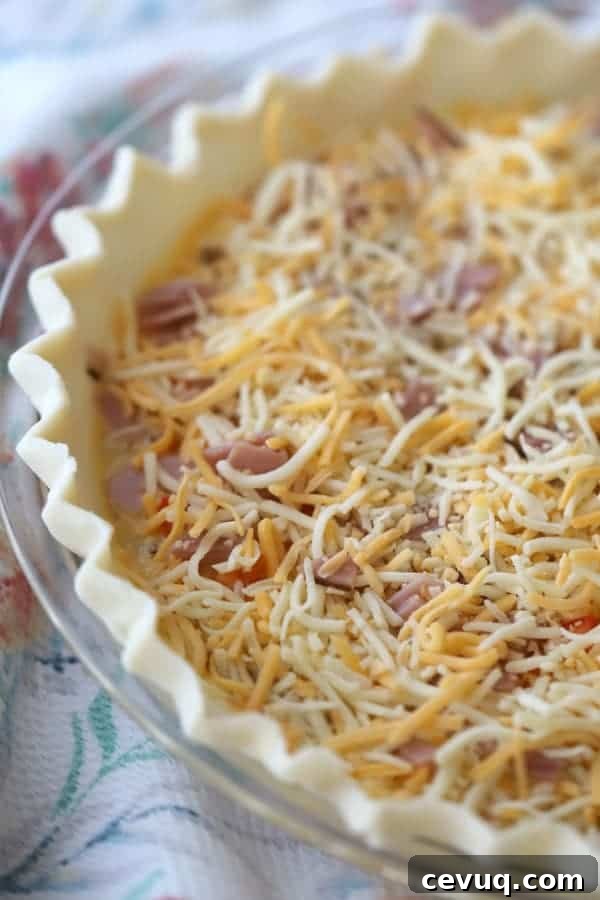 Classic Ham and Cheese Quiche with Flaky Crust 3 Ham and cheese in a frozen pie crust ready to add the filling and bake.