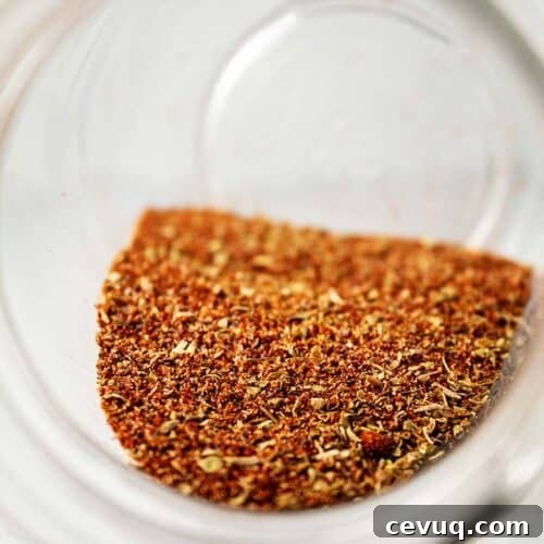Homemade Chili Seasoning Mix for Authentic, Bold Flavor 17 inside of glass jar with focus on homemade chili seasoning