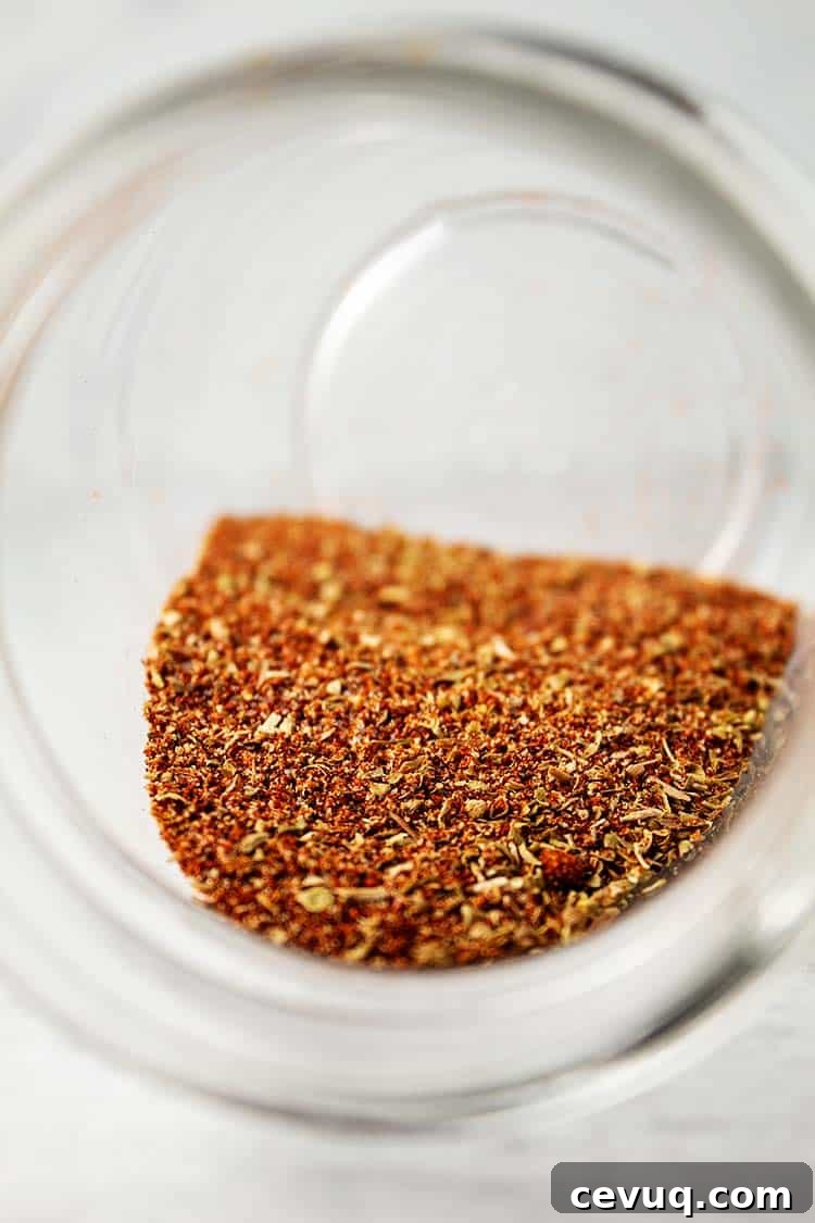 Homemade Chili Seasoning Mix for Authentic, Bold Flavor 3 inside of glass jar with focus on homemade chili seasoning