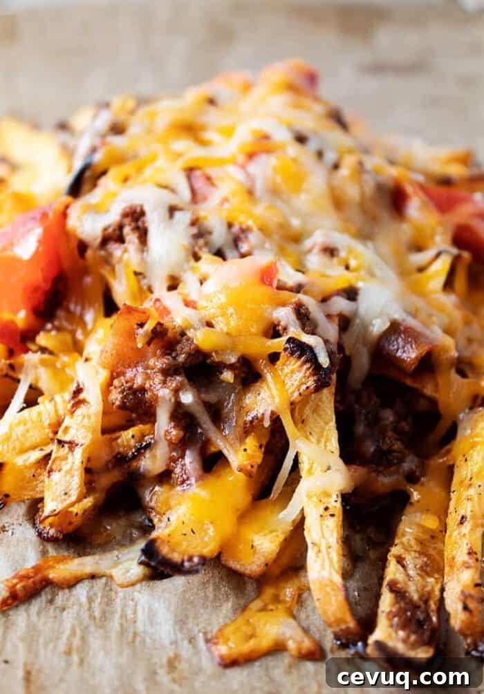 Homemade Chili Seasoning Mix for Authentic, Bold Flavor 6 closeup of keto chili cheese fries on a baking sheet with parchment paper
