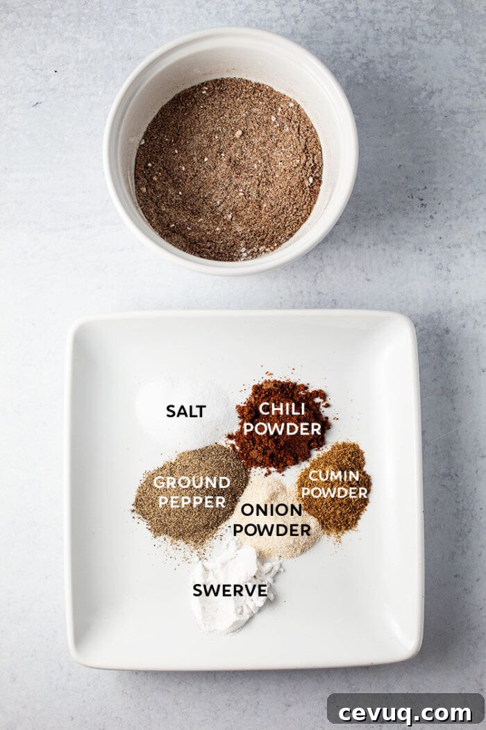 Homemade Chili Seasoning Mix for Authentic, Bold Flavor 9 keto rib rub ingredients on a white plate next to a bowl of rib rub