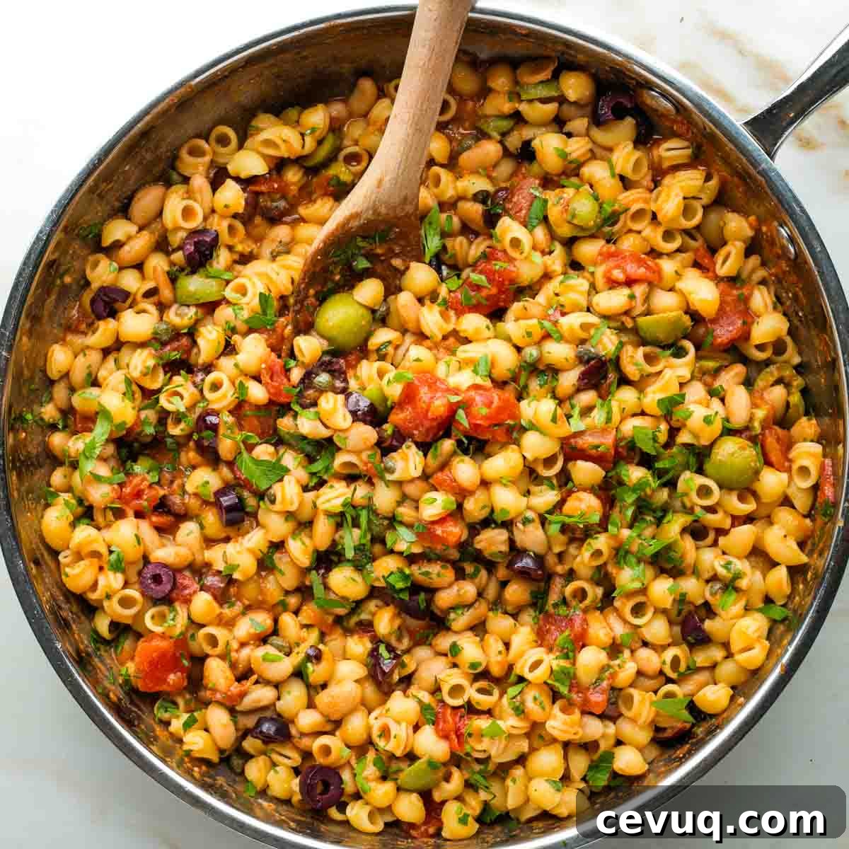 Vegan White Bean Puttanesca Pasta 10 White beans, small pasta, black and green olives, plus capers and fresh parsley in a chunky tomato base.