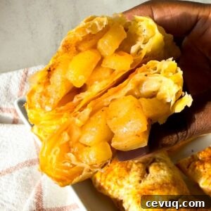 Flaky Apple Hand Pies with Puff Pastry 12 Golden brown puff pastry apple hand pies with flakey layers and spiced apple filling.