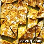 Golden Milk Frozen Yogurt Bark - inspired by golden milk this bark is infused with healthy turmeric! It's creamy, nutty, with crystallized ginger for a nice kick! This recipe is easy to make is is perfect for summer! Gluten Free.