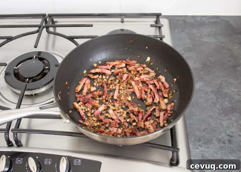 Spicy Tomato and Chili Pasta Recipe 4 Onion, chilli and pancetta frying in a pan