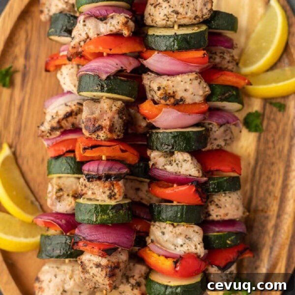 Pork kabobs with slice zucchini, red onions and bell peppers.