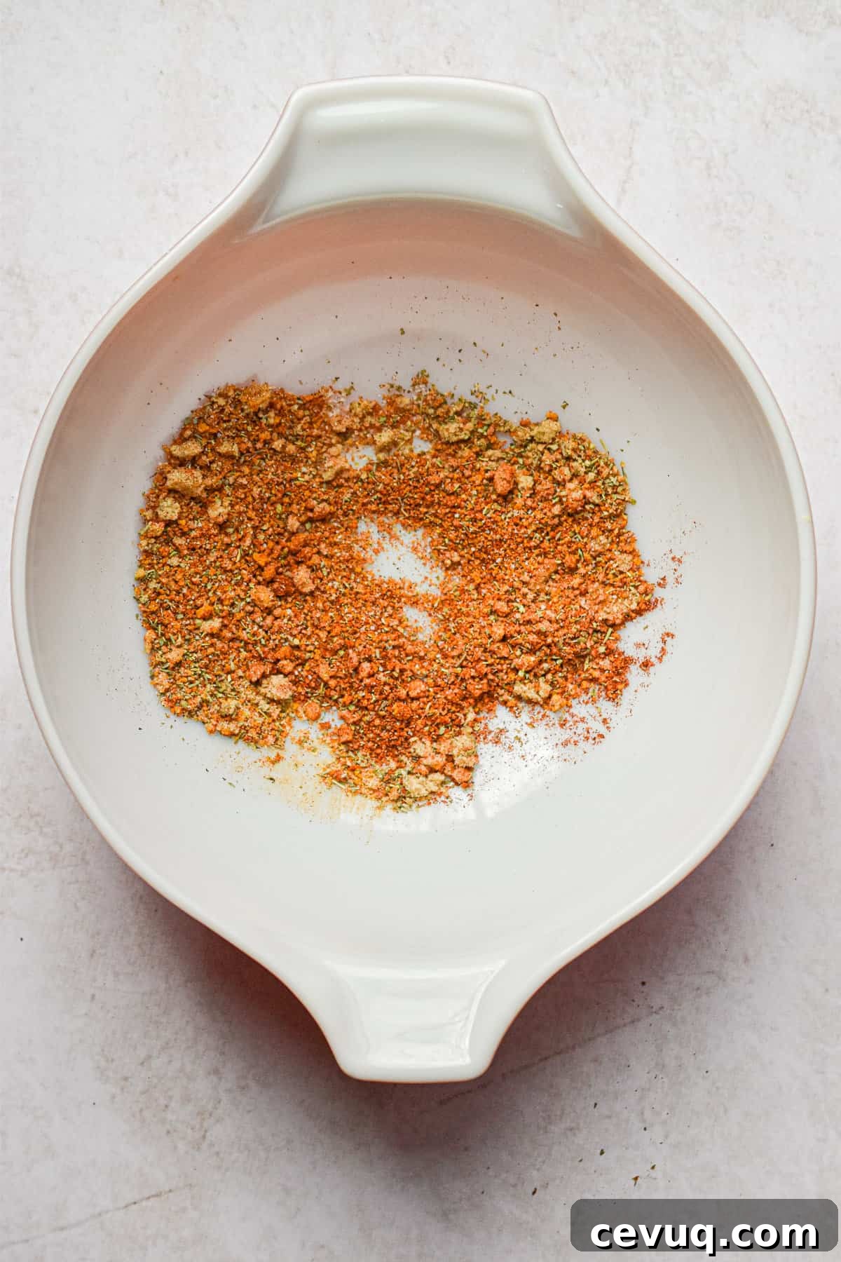 Tender, Juicy Instant Pot Chicken Drumsticks Recipe 4 The seasoning is added to the mixing bowl.