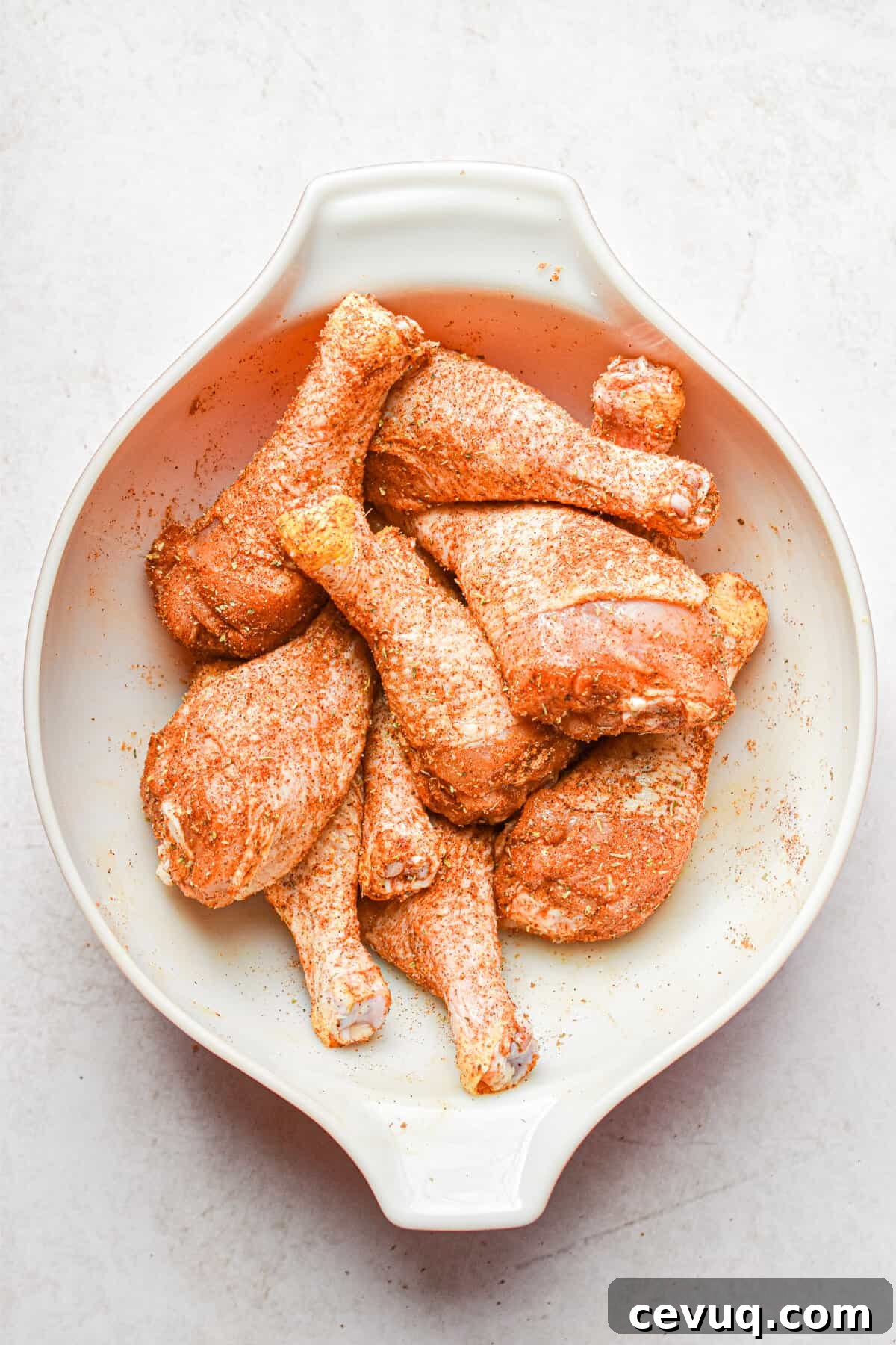 Tender, Juicy Instant Pot Chicken Drumsticks Recipe 6 Chicken legs are coated in seasoning.