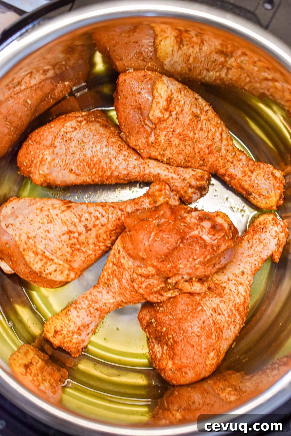 Tender, Juicy Instant Pot Chicken Drumsticks Recipe 7 The chicken is added to the Instant Pot.