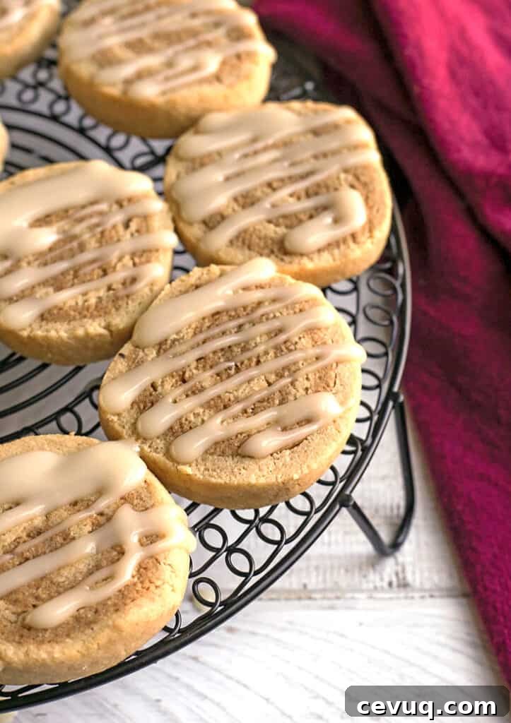 paleo cinnamon roll cookies on a cooling rack 